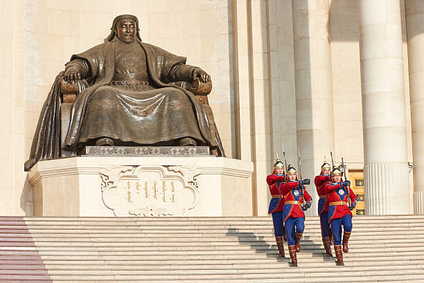 Ulan Bator, Mongolia - January 25, 2015: four soldiers belonging to Mongolian Armed Forces Honorary Guard descend the stairs at the Monument of Chinggis Khaan, in Sukhbaatar Square.